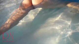 Elegant and flexible babe, swimming underwater in the outdoor swimming pool. 2 2