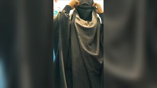 Jalbab Algerian Muslim woman shows her body behind hijab