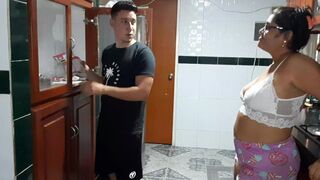 My stepmother sucks my cock in the kitchen